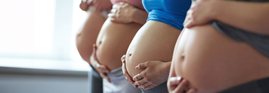 Several pregnant bellies in a row